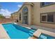 Inviting swimming pool with clear blue water and a spacious patio, perfect for outdoor relaxation and entertaining at 10680 Sapphire Vista Ave, Las Vegas, NV 89144