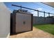 Outdoor shed featuring a dormer window with turf and gravel in the backyard at 109 Ash St, Henderson, NV 89015