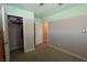 Cozy bedroom featuring two-tone painted walls, closet, and interior door at 109 Ash St, Henderson, NV 89015