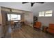 Dining room with an open floor plan, ceiling fan, and large windows at 109 Ash St, Henderson, NV 89015