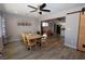 Bright dining room with modern ceiling fan, wood table and barn door at 109 Ash St, Henderson, NV 89015
