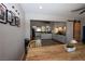 Open dining room and kitchen with modern ceiling fan and neutral walls at 109 Ash St, Henderson, NV 89015