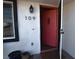A close up of a house number by an open door at 109 Ash St, Henderson, NV 89015