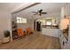 Open concept living area between kitchen and dining room with natural lighting at 109 Ash St, Henderson, NV 89015