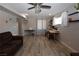 Open-concept living area with natural light, a ceiling fan, and a workstation at 109 Ash St, Henderson, NV 89015