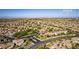 Wide aerial view showcases neighborhood with the Las Vegas Strip on the horizon at 12021 La Palmera Ave, Las Vegas, NV 89138