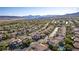 Scenic aerial view showcases neighborhood, mountain views, and home's prime location at 12021 La Palmera Ave, Las Vegas, NV 89138