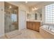 Bathroom featuring a glass shower, soaking tub, vanity with sink and tile flooring at 12021 La Palmera Ave, Las Vegas, NV 89138