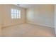 Bedroom featuring neutral carpet, plantation shutters, and neutral walls at 12021 La Palmera Ave, Las Vegas, NV 89138