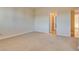 Spacious carpeted bedroom with neutral walls and trim providing a clean, modern look and feel at 12021 La Palmera Ave, Las Vegas, NV 89138