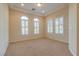 Well-lit, carpeted bedroom features multiple shuttered windows, recessed lights, and a tray ceiling at 12021 La Palmera Ave, Las Vegas, NV 89138
