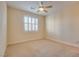Bright and airy bedroom with neutral decor, plantation shutters, and a ceiling fan at 12021 La Palmera Ave, Las Vegas, NV 89138