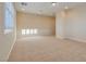 Large room with recessed lighting and a bright window, complete with off-white walls and neutral carpeting at 12021 La Palmera Ave, Las Vegas, NV 89138