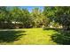 Community green space with benches, trees, garden, and walking path on a sunny day at 12021 La Palmera Ave, Las Vegas, NV 89138