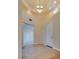 Bright foyer showcasing tiled floors, recessed lighting, a chandelier, and an arched doorway at 12021 La Palmera Ave, Las Vegas, NV 89138