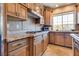 Well-equipped kitchen with granite countertops, tile backsplash, and sleek stainless steel appliances at 12021 La Palmera Ave, Las Vegas, NV 89138