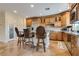 Kitchen featuring an island with seating and stainless steel appliances at 12021 La Palmera Ave, Las Vegas, NV 89138