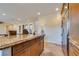 Kitchen island with granite countertop, cabinets, and stainless steel refrigerator at 12021 La Palmera Ave, Las Vegas, NV 89138