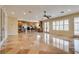 Spacious living area with tile floors, ceiling fan, and access to kitchen at 12021 La Palmera Ave, Las Vegas, NV 89138