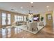 Spacious living room features a fireplace, ceiling fan, and French doors leading to the outside at 12021 La Palmera Ave, Las Vegas, NV 89138