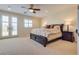 Spacious main bedroom with a ceiling fan, access to balcony and lots of natural light at 12021 La Palmera Ave, Las Vegas, NV 89138