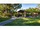 A park features a gazebo, lush greenery, and a paved walkway for enjoying leisurely strolls at 12021 La Palmera Ave, Las Vegas, NV 89138