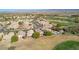 An aerial view showcasing homes with backyards, swimming pools, and beautiful desert and mountain views in the background at 1441 Palm Dr, Laughlin, NV 89029