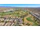 This image shows a sprawling neighborhood by a golf course, with beautiful desert and mountain views in the distance at 1441 Palm Dr, Laughlin, NV 89029