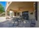 Relaxing covered back patio with outdoor seating and view to the yard at 1441 Palm Dr, Laughlin, NV 89029