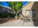 Backyard patio with table and grill, complemented by low-maintenance desert landscaping at 1441 Palm Dr, Laughlin, NV 89029