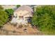A beautiful home featuring a cozy covered patio, a fountain, and a lush, landscaped backyard with native plants at 1441 Palm Dr, Laughlin, NV 89029