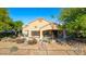 Charming backyard with a covered patio, fountain, and a beautifully landscaped garden, perfect for outdoor living at 1441 Palm Dr, Laughlin, NV 89029