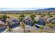 Stunning desert homes with front-facing garages overlooking a lush golf course on a sunny day at 1441 Palm Dr, Laughlin, NV 89029