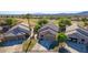 Desert homes with front facing garages and mature landscaping on a golf course at 1441 Palm Dr, Laughlin, NV 89029