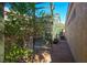 Exterior shot of side yard featuring lush landscaping and outdoor structure at 1441 Palm Dr, Laughlin, NV 89029