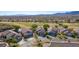 Beautiful desert homes with golf course views and an inviting pool on a sunny day at 1441 Palm Dr, Laughlin, NV 89029