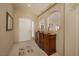 Entryway with arched openings, neutral tones and a decorative cabinet at 1441 Palm Dr, Laughlin, NV 89029