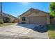 A beautiful single-story house with a two-car garage and a well-manicured lawn at 1441 Palm Dr, Laughlin, NV 89029