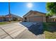Lovely single-story residence featuring desert landscaping, a two-car garage, and a spacious driveway at 1441 Palm Dr, Laughlin, NV 89029