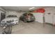 Spacious garage with parking for two cars plus storage cabinets and overhead door at 1441 Palm Dr, Laughlin, NV 89029