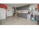 Spacious garage with epoxy flooring and custom cabinets for ample storage and organization at 1441 Palm Dr, Laughlin, NV 89029