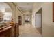 Hallway featuring tile flooring, arched entries and views into other rooms at 1441 Palm Dr, Laughlin, NV 89029
