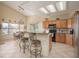 Bright kitchen features tiled floors, granite counters, breakfast bar and ample cabinet space at 1441 Palm Dr, Laughlin, NV 89029
