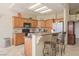 Kitchen features tiled floors, stainless appliances, breakfast bar, and ample cabinet space at 1441 Palm Dr, Laughlin, NV 89029