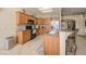 Kitchen features tiled floors, breakfast bar and stainless appliances with ample counter space at 1441 Palm Dr, Laughlin, NV 89029