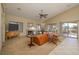 Open living room featuring a fireplace, ceiling fan, and a view of the backyard at 1441 Palm Dr, Laughlin, NV 89029