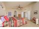 Bright main bedroom boasting archways, Southwestern linens, carpet and comfortable setting at 1441 Palm Dr, Laughlin, NV 89029