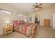 Relaxing main bedroom showcasing side tables, archways, Southwestern style linens and lots of carpet at 1441 Palm Dr, Laughlin, NV 89029