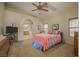 Bedroom with carpet, ceiling fan and ensuite bathroom at 1441 Palm Dr, Laughlin, NV 89029