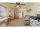 Versatile home office featuring bookshelves, storage, and comfortable seating at 1441 Palm Dr, Laughlin, NV 89029